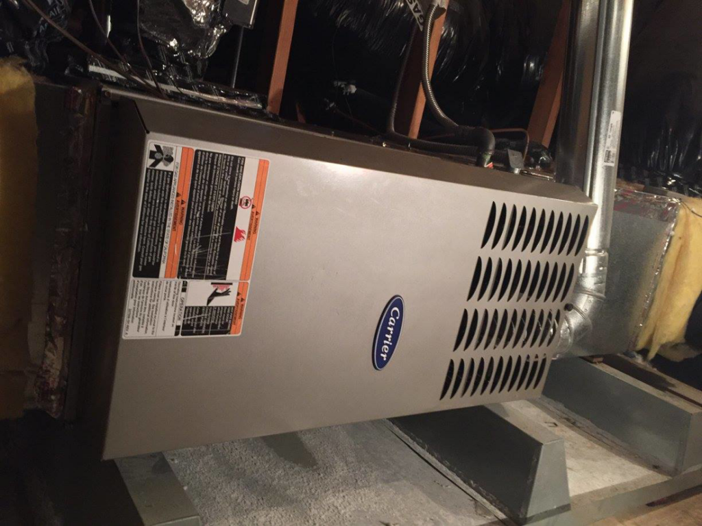 An indoor Carrier furnace unit installed in an attic or crawl space by A and R Air Conditioning & Heating furnace in San Jose, CA.