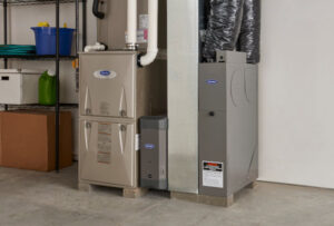 An indoor Carrier HVAC system, including a furnace and air handler, installed by Delgado Enterprises in Pittsburgh, PA