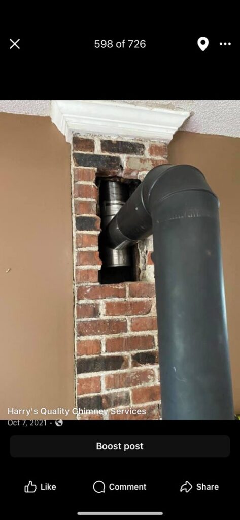 An indoor chimney pipe installation in progress, showing exposed brickwork, by Harry's Quality Chimney Services in Kansas City, MO