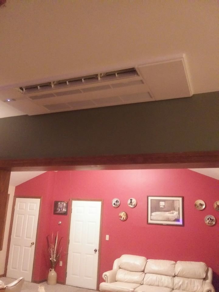 An indoor ducted HVAC unit installed in the ceiling of a living room by Superior CO-OP HVAC in Cambridge, NY.