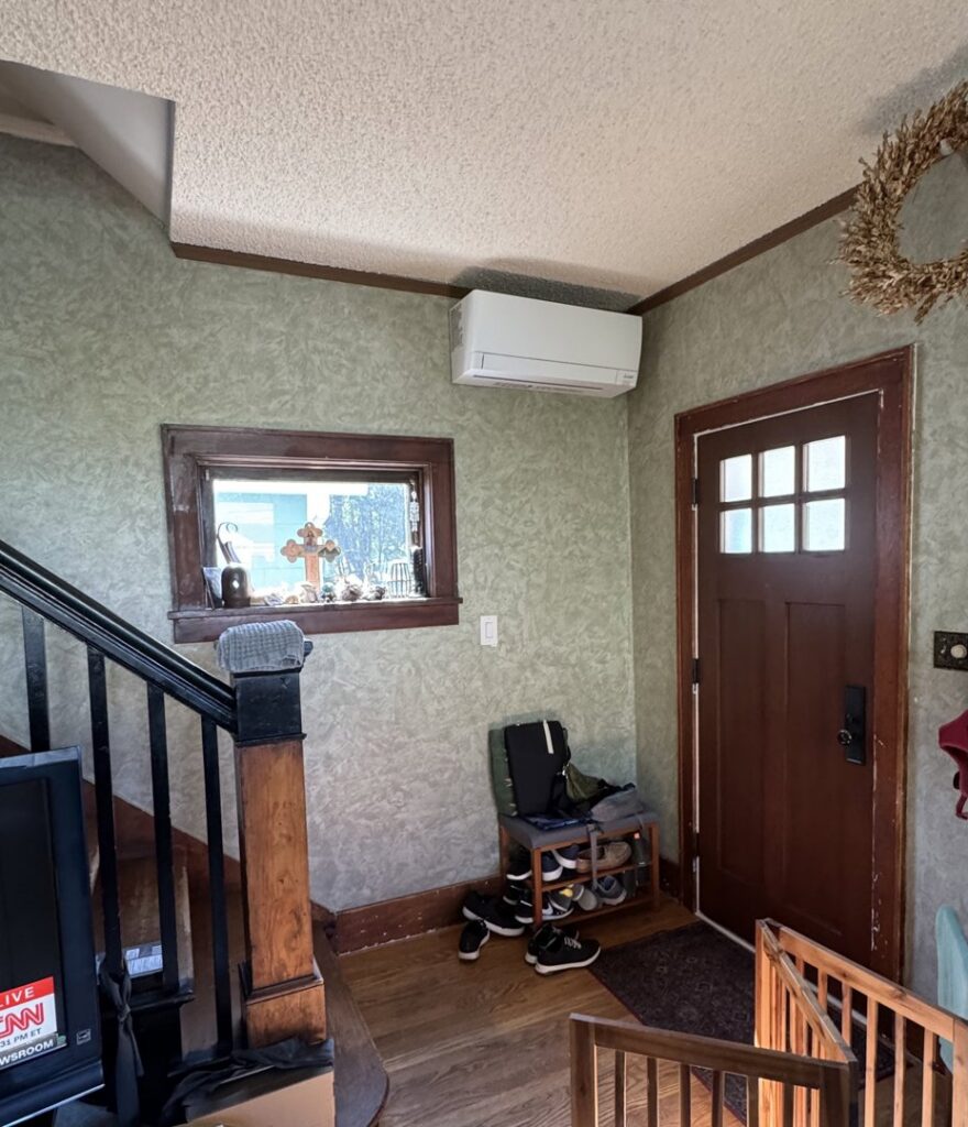 An indoor ductless mini-split unit installed near an entryway by Progressive Comfort Solutions in Seattle, WA.