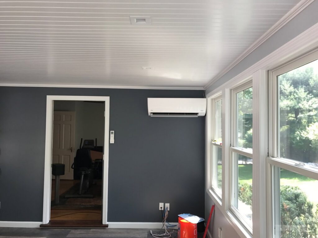 An indoor ductless mini-split unit installed on a wall in a room by Climate Care Heating & Air Conditioning in Norwalk, CT