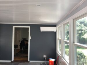 An indoor ductless mini-split unit installed on a wall in a room by Climate Care Heating & Air Conditioning in Norwalk, CT