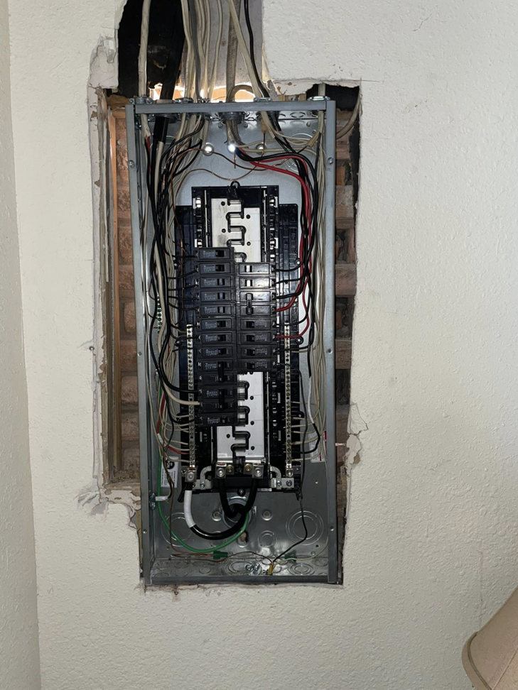 An indoor electrical breaker panel installation with wiring by Savoski's Electrical & AC, LLC in Sunset, LA