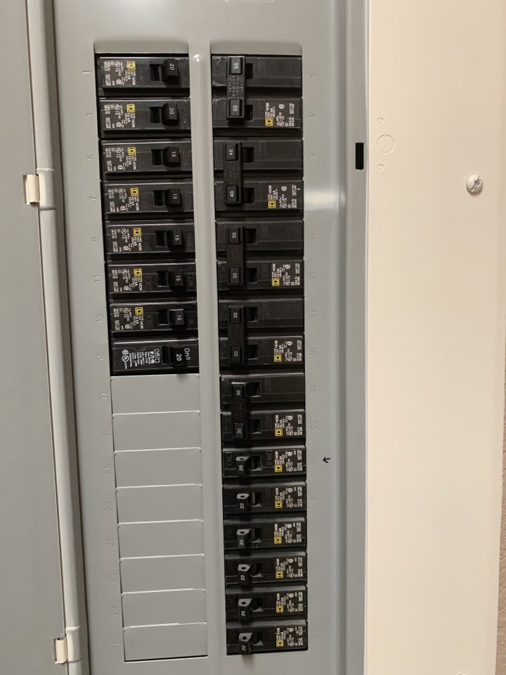 A close-up view of an indoor electrical breaker panel, a service provided by Minuteman Home Services in Mesa, AZ
