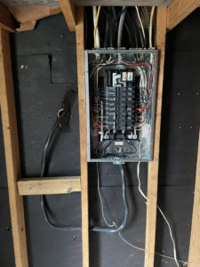 An indoor electrical panel rough-in with wiring in an unfinished wall by Savoski's Electrical & AC, LLC in Sunset, LA