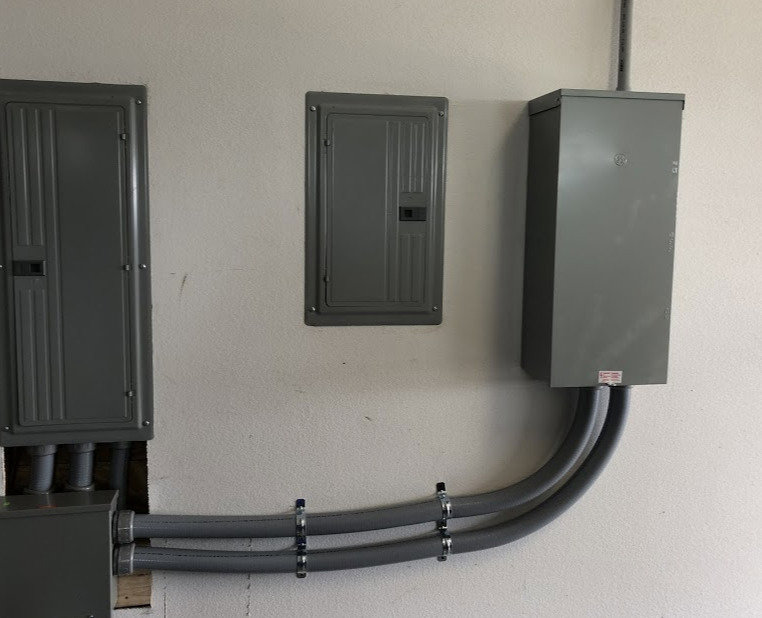 Indoor electrical panels and conduit installed in a building by 4G Electrician in Dallas, TX