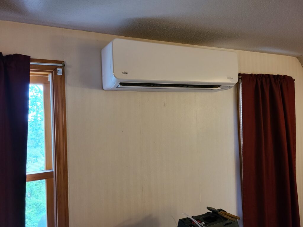 An indoor Fujitsu mini-split air handler unit installed by Hampden County HVAC Inc. in Indian Orchard, MA