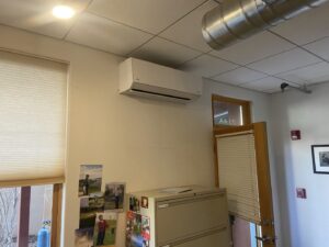 An indoor Fujitsu mini-split HVAC unit installed in an office setting by Santa Fe Heating & Cooling LLC in Santa Fe, NM.