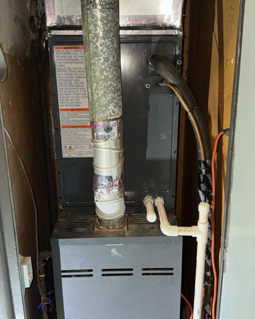 An indoor furnace and air handler unit with ductwork and piping installed by AirTech Solutions LLC in Broken Arrow, OK.