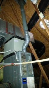 An indoor furnace and air handler unit installed in an attic by Air Vent Master in Charlotte, NC.