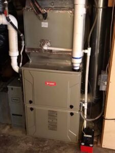 An indoor Bryant furnace or air handler with ductwork installed by DeHart Plumbing, Heating, & Air in Sparks, NV.