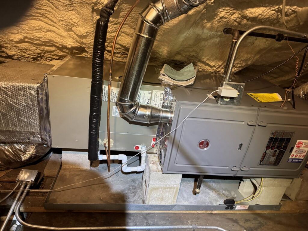 An indoor furnace and air handler with ductwork installed by Etek Refrigeration Heating and Cooling, Inc. in Chicago, IL.