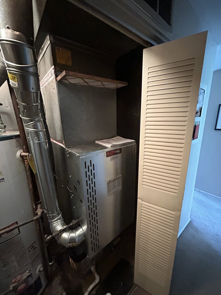 An indoor furnace or air handler unit with ductwork and a filter, serviced by Fire & Ice Mechanical in South Elgin, IL