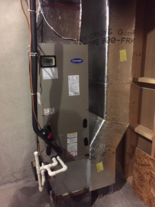 An indoor furnace and air handler unit with ductwork, serviced by Hitz Heating Inc. in Harrisburg, PA.