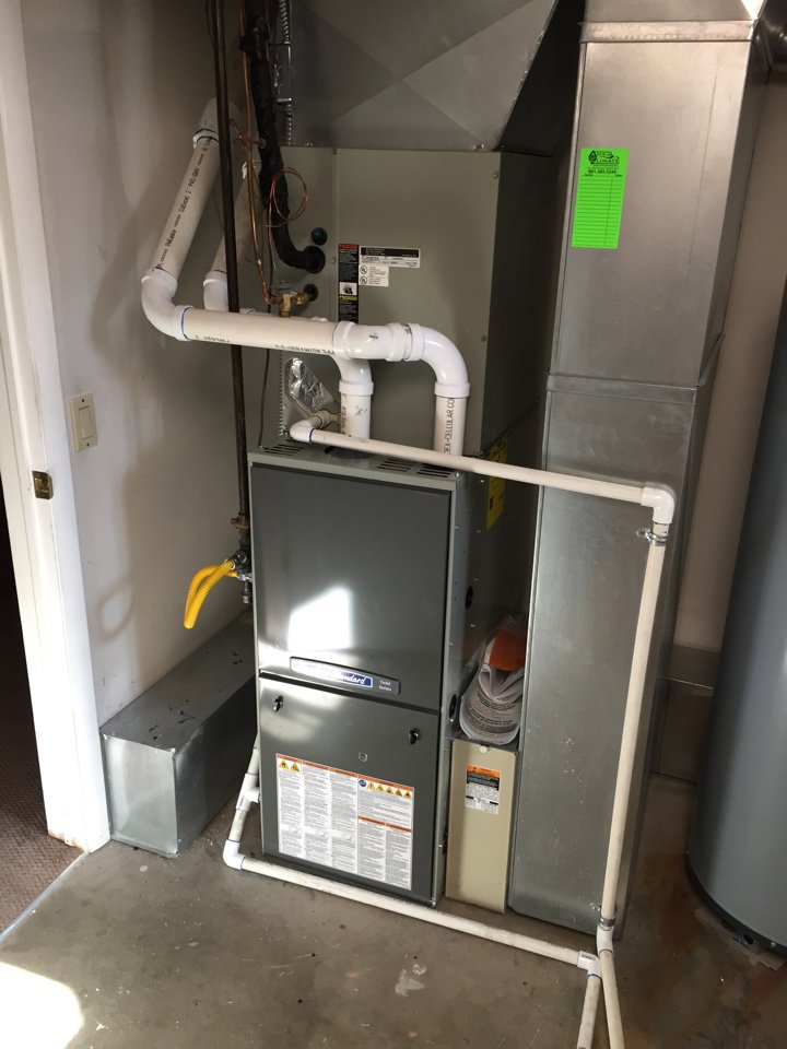 An indoor furnace and air handler unit with ductwork and piping installed by Any Climate Mechanical HVAC in Sandy, UT.