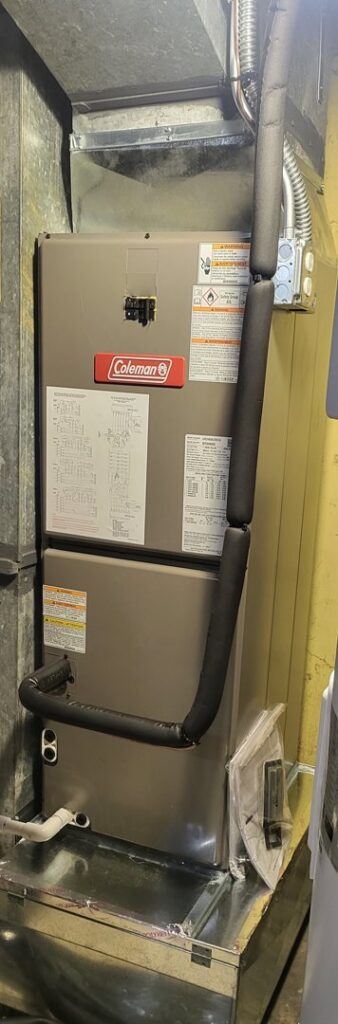 An indoor furnace and air handler unit installed by Assured Energy Solutions, an HVAC contractor in Frankfort, IL.