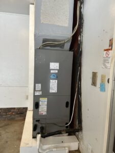 An indoor furnace and air handler unit installed by Breezy Heating and Cooling in Mobile, AL.