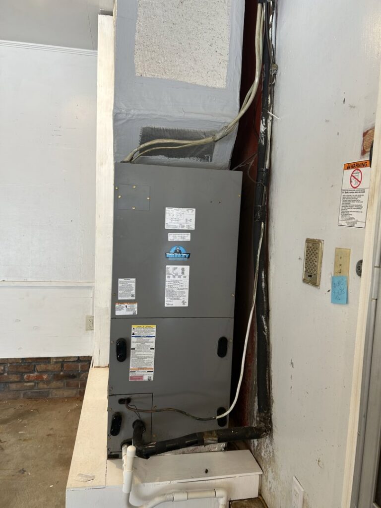 An indoor furnace and air handler unit installed by Breezy Heating and Cooling in Mobile, AL.