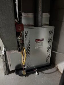 An indoor furnace and air handler unit with ductwork installed by Brothers HVAC LLC in Owings Mills, MD