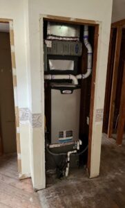 An indoor furnace and air handler unit being installed by Comfort Shield HVAC Services of NC in Smithfield, NC.