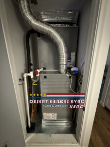 An indoor furnace and air handler unit with ductwork installed in a closet by Desert Heroes HVAC in Phoenix, AZ