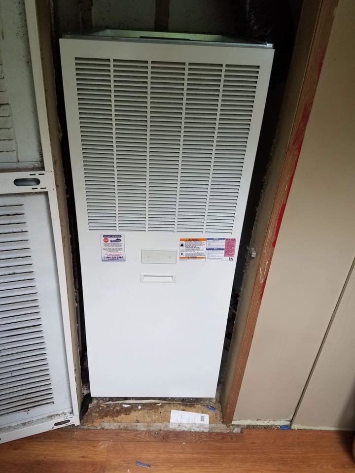 An indoor furnace or air handler unit installed in a utility space by Eastern Air Flow of Kentucky in Richmond, KY.