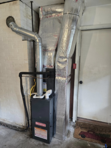 An indoor furnace and air handler unit with insulated ductwork installed by Jesse's HVAC LLC in Newport News, VA.