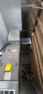 An indoor furnace and air handler unit with ductwork, installed by Jv Services inc. in Pinellas Park, FL.
