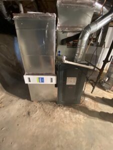 An indoor furnace and air handler unit with ductwork installed by Malone Heat & Air, Inc. in Chattanooga, TN