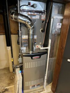 A newly installed or serviced indoor furnace and air handler unit by Neal Harris Service Experts in Overland Park, KS.