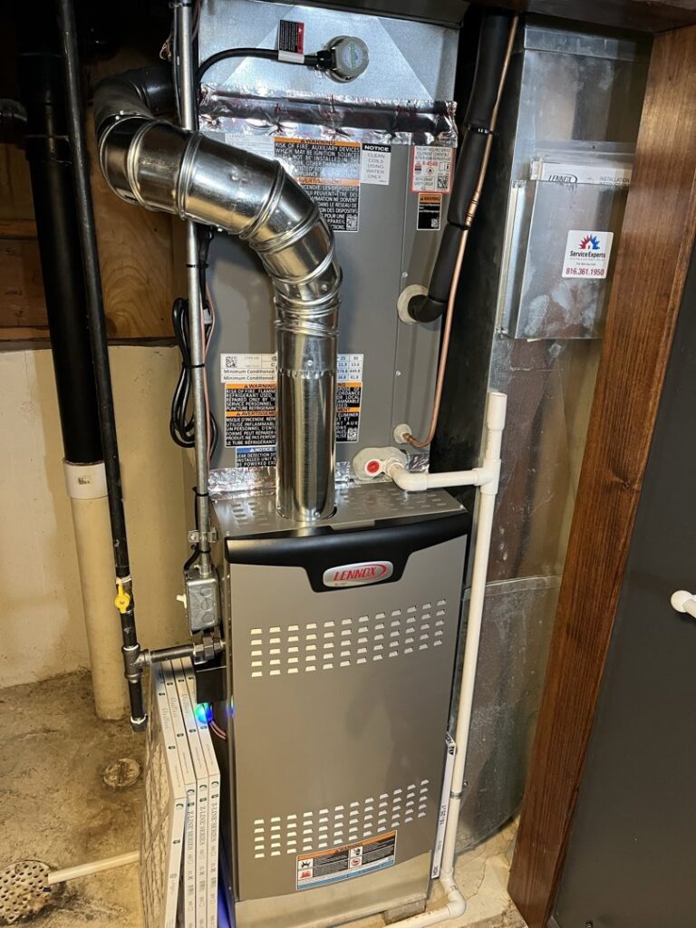 A newly installed or serviced indoor furnace and air handler unit by Neal Harris Service Experts in Overland Park, KS.