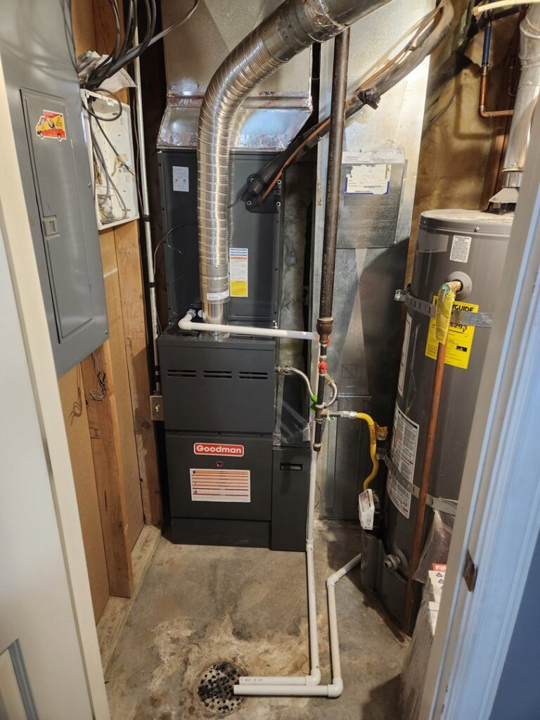 An indoor furnace and air handler unit installed in a utility space by Simple Valley Heating and Cooling in Orem, UT