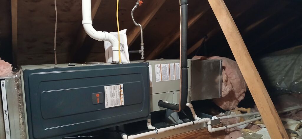 An indoor furnace and air handler unit installation with ductwork by Southern Oregon Heating & Air Conditioning in Medford, OR