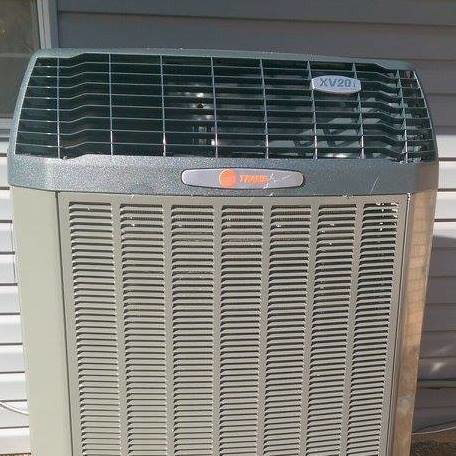 An indoor furnace or air handler unit with exposed wiring and components, installed by Stevens Refrigeration & Heating in Enid, OK