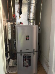 An indoor King furnace and air handler unit professionally installed in a utility closet by Underwood Heating and Air Conditioning in Phenix City, AL