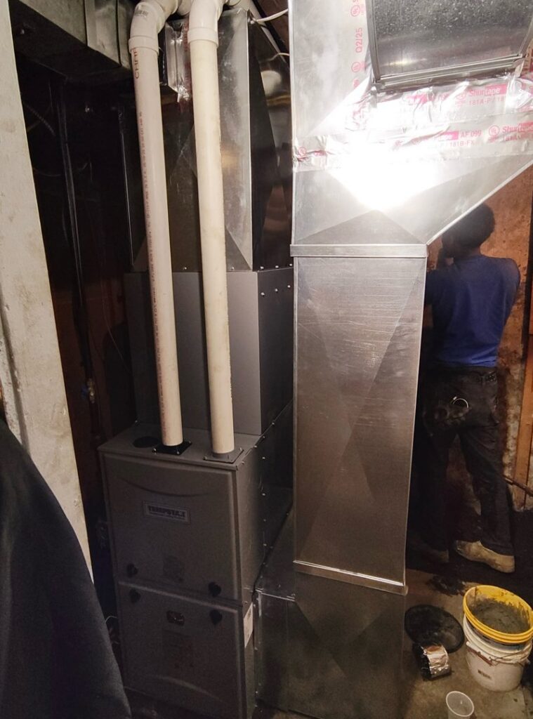An indoor furnace and air handler installation with ductwork by Zongora Comfort Solutions LLC in Allentown, PA.