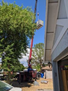 An indoor furnace or air handler unit being serviced or installed in an attic by ASAP Air Conditioning and Heating in Mesa, AZ.