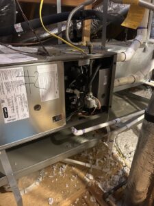An indoor furnace or air handler unit with an open panel during service by Sonnyreena Mechanical LLC in Garland, TX