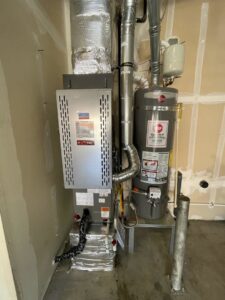 An indoor furnace and air handler system with ductwork, installed by Best Heat & Air in Tacoma, WA.