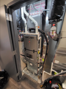 An indoor furnace and air handler system installed by Zibi Construction in Mount Prospect, IL.