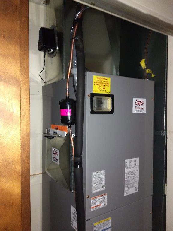 An indoor furnace or air handler unit with Cafco Services branding in Cincinnati, OH.