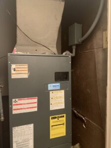 An indoor furnace or air handler unit installed by Comfort Breeze HVAC Refrigeration in Mobile, AL.