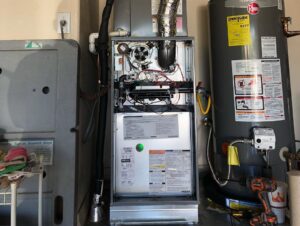 An indoor furnace or air handler unit with its panel open, serviced by Diamond AC and Heating in Phoenix, AZ.