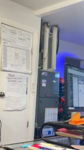 An indoor furnace and air handler unit with ductwork installed by Metro Air Conditioning, Heating & Services in Dallas, TX