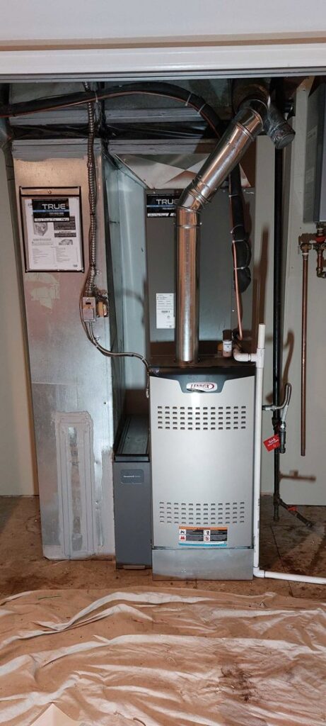 An indoor furnace and air handler unit installed by True Heating and Cooling in Greenfield, IN.