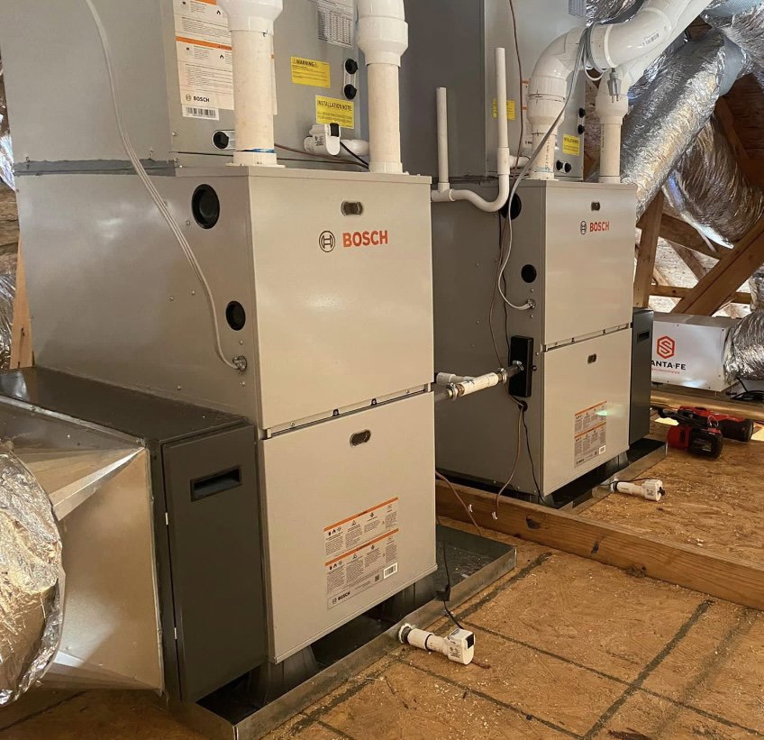 Two indoor furnace and air handler units installed by Chapman HVAC in Cleveland, OK.