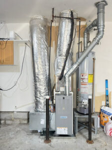 An indoor furnace and water heater installation by CHIN Flower HVAC LLC in Murfreesboro, TN.