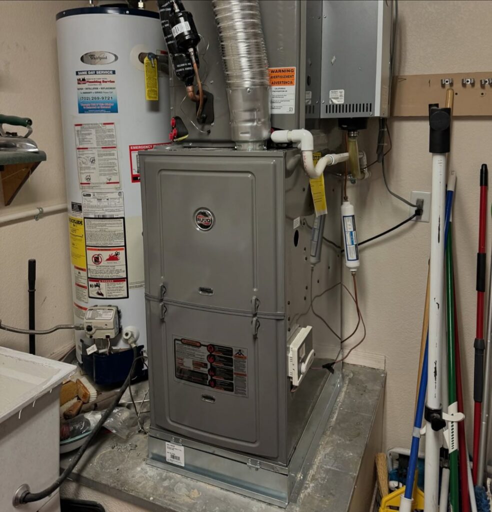 An indoor furnace and water heater installed in a utility closet by Cool Camel HVAC in Henderson, NV