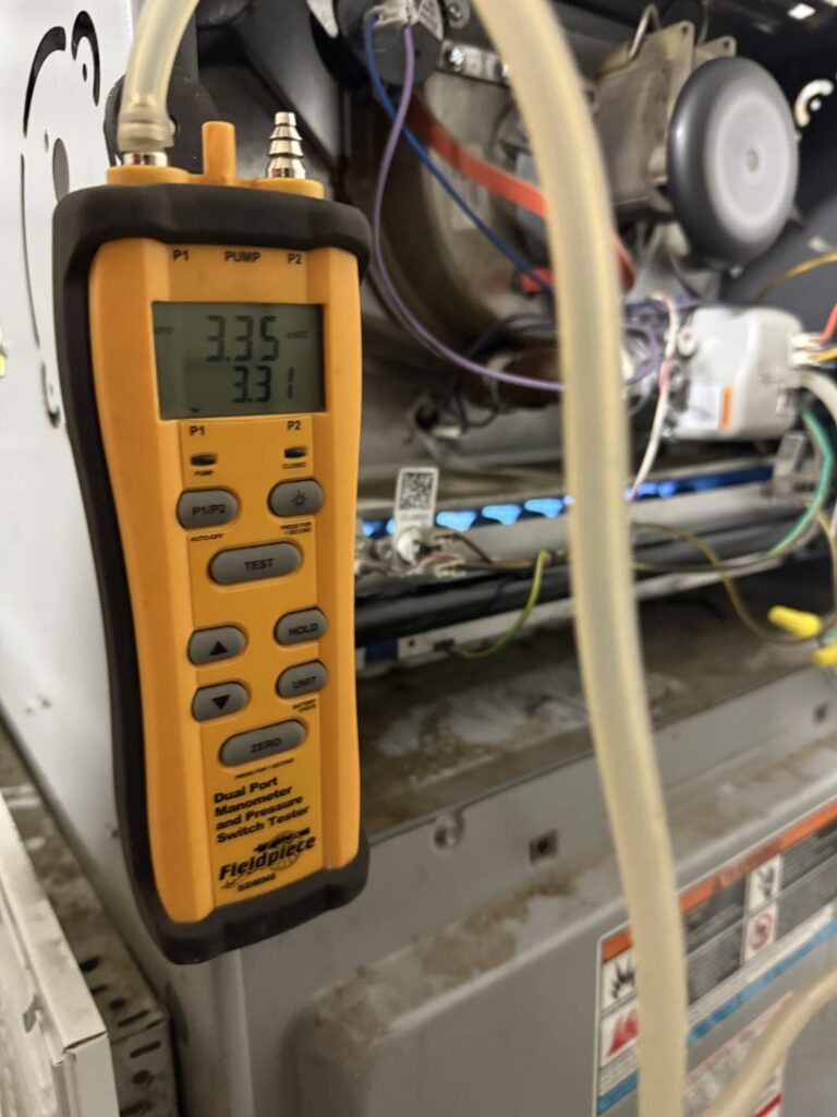 An indoor furnace unit installed next to a water heater by S&B heating and cooling in Florence, KY.